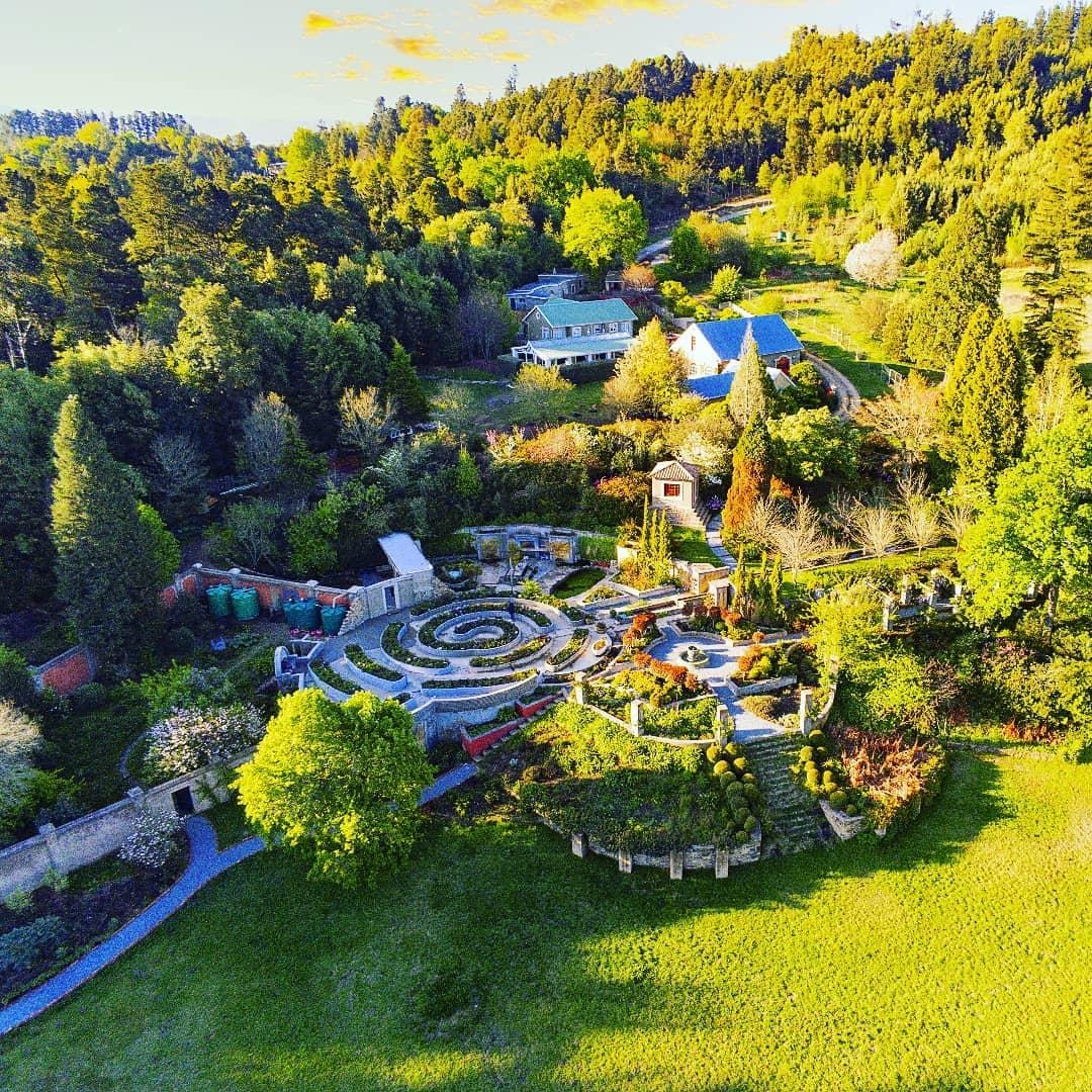 Aerial view of the Evergarde Estate garden labyrinth at golden hour